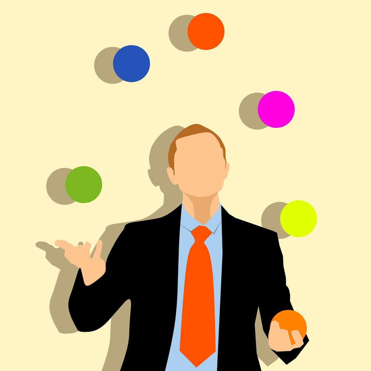 Man in suit juggling balls